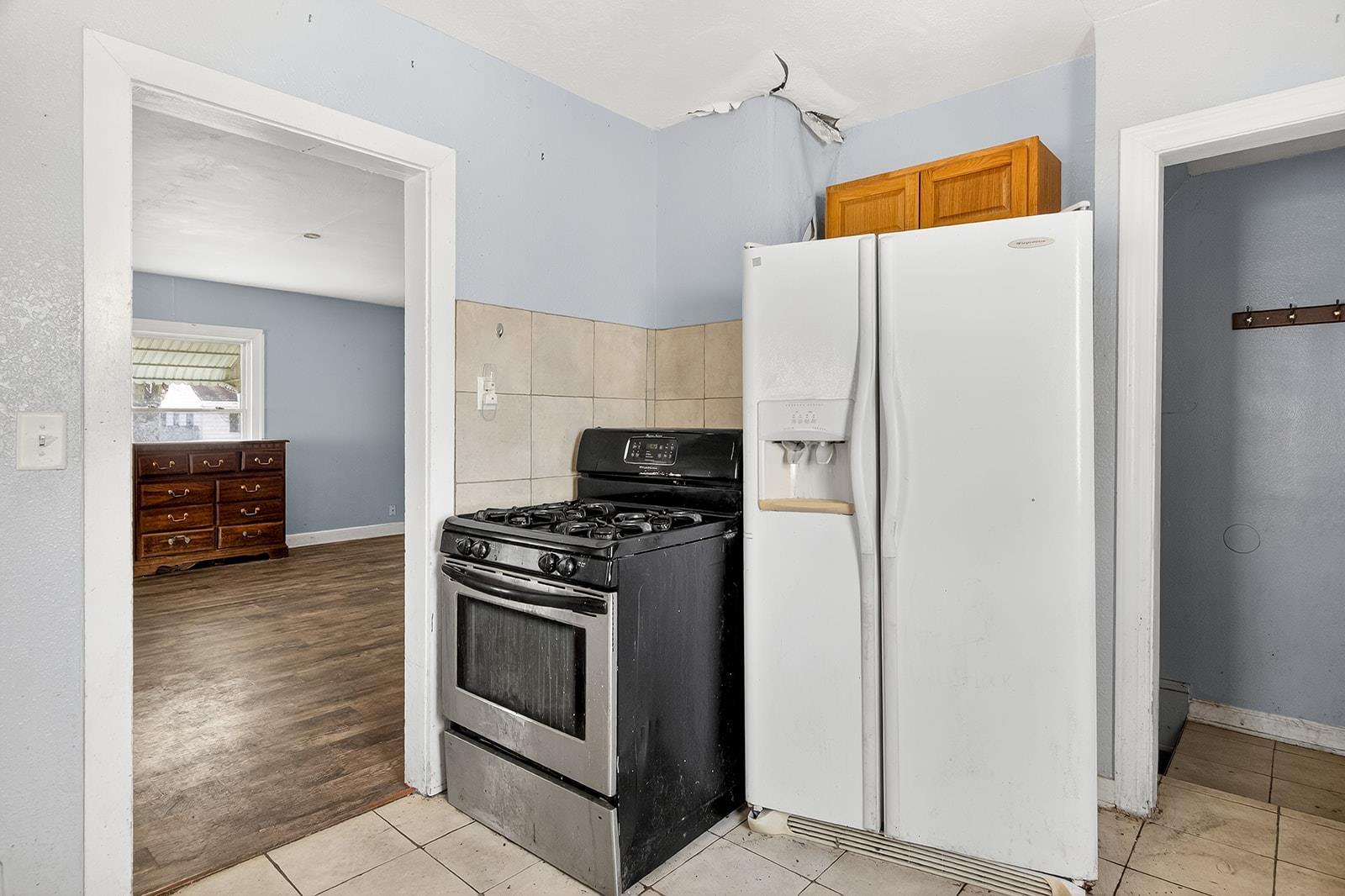 2823 Ridgeway Avenue Rockford, IL 61101 - Photo 15 of 28 a white refrigerator freezer and a stove sitting inside of a kitchen