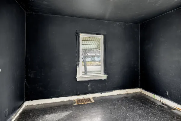 a view of an empty room with a window