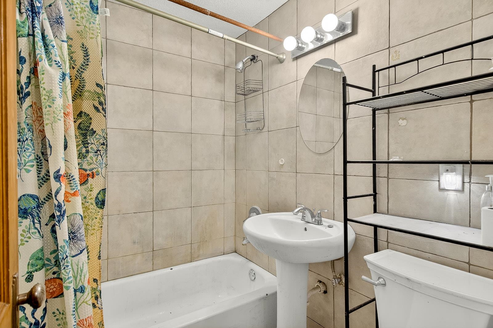 2823 Ridgeway Avenue Rockford, IL 61101 - Photo 21 of 28 a bathroom with a sink a toilet and shower