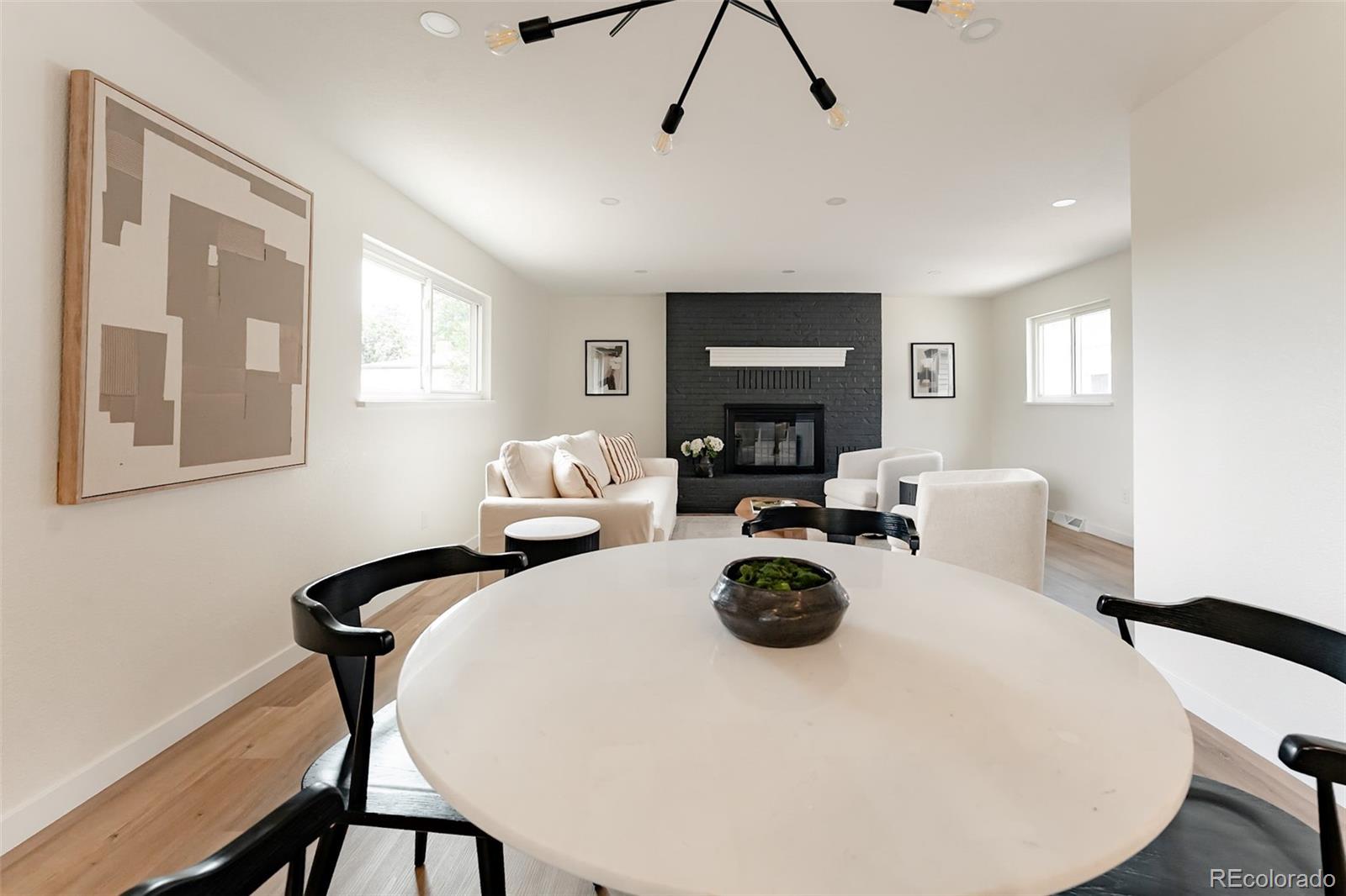 1279 South Raritan Street Denver, CO 80223 - Photo 6 of 25 a view of a dining room with furniture and chandelier