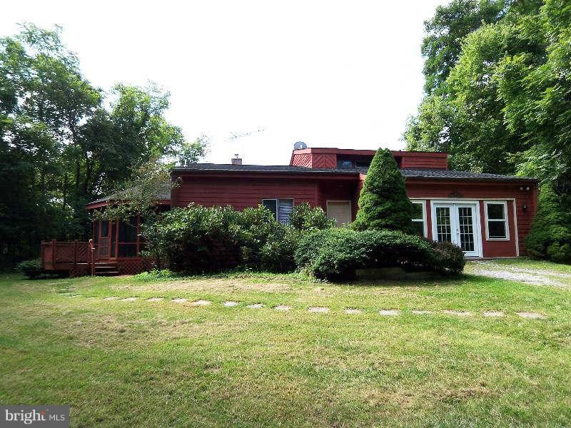 667 Morgan Grove Road Shepherdstown, WV 25443 - Photo 1 of 30 a view of a house with a yard and a garden