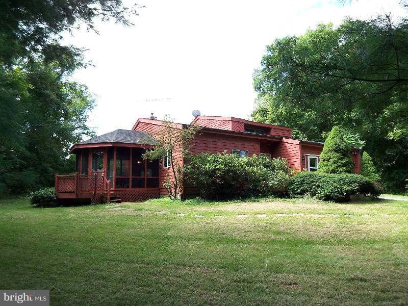 667 Morgan Grove Road Shepherdstown, WV 25443 - Photo 2 of 30 a view of a house with a garden