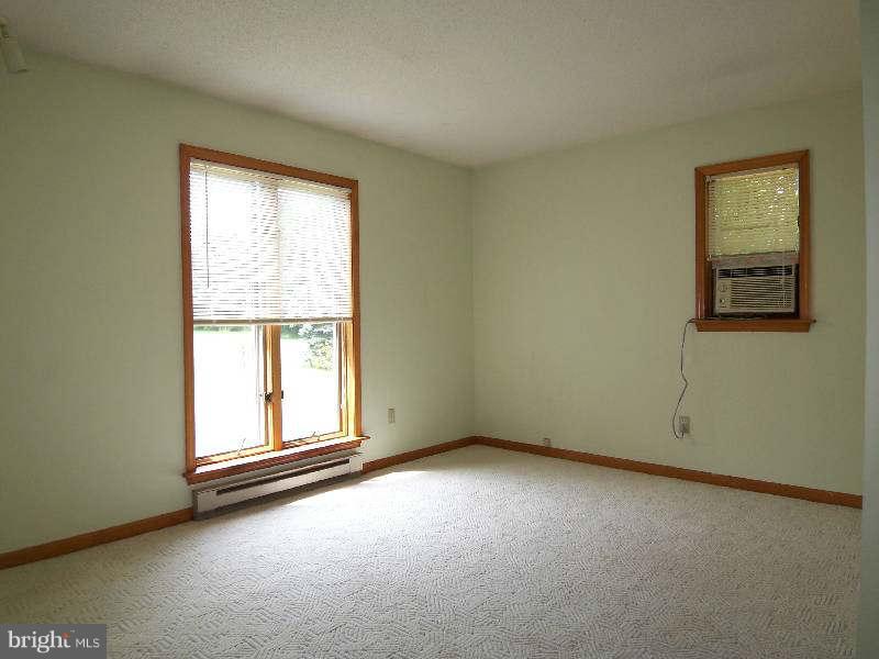 667 Morgan Grove Road Shepherdstown, WV 25443 - Photo 14 of 30 an empty room with a window