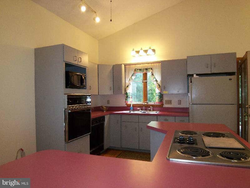 667 Morgan Grove Road Shepherdstown, WV 25443 - Photo 19 of 30 a kitchen that has a sink cabinets counter space and appliances