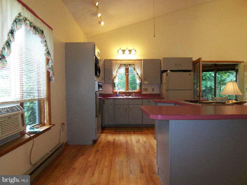 667 Morgan Grove Road Shepherdstown, WV 25443 - Photo 20 of 30 a kitchen with stainless steel appliances a refrigerator and a sink