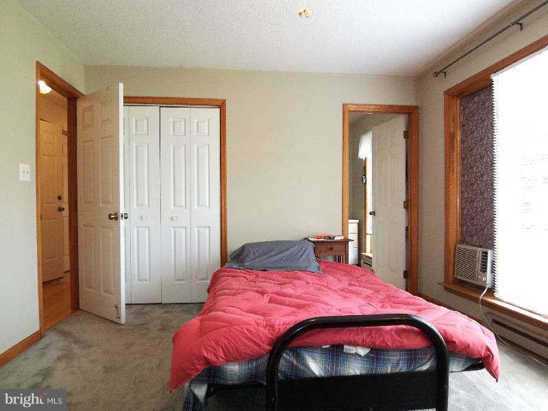 667 Morgan Grove Road Shepherdstown, WV 25443 - Photo 25 of 30 a bedroom with a bed and a window
