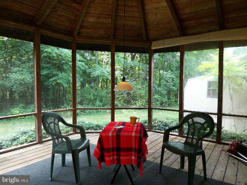 667 Morgan Grove Road Shepherdstown, WV 25443 - Photo 6 of 30 a view of a dining room with furniture window and outside view