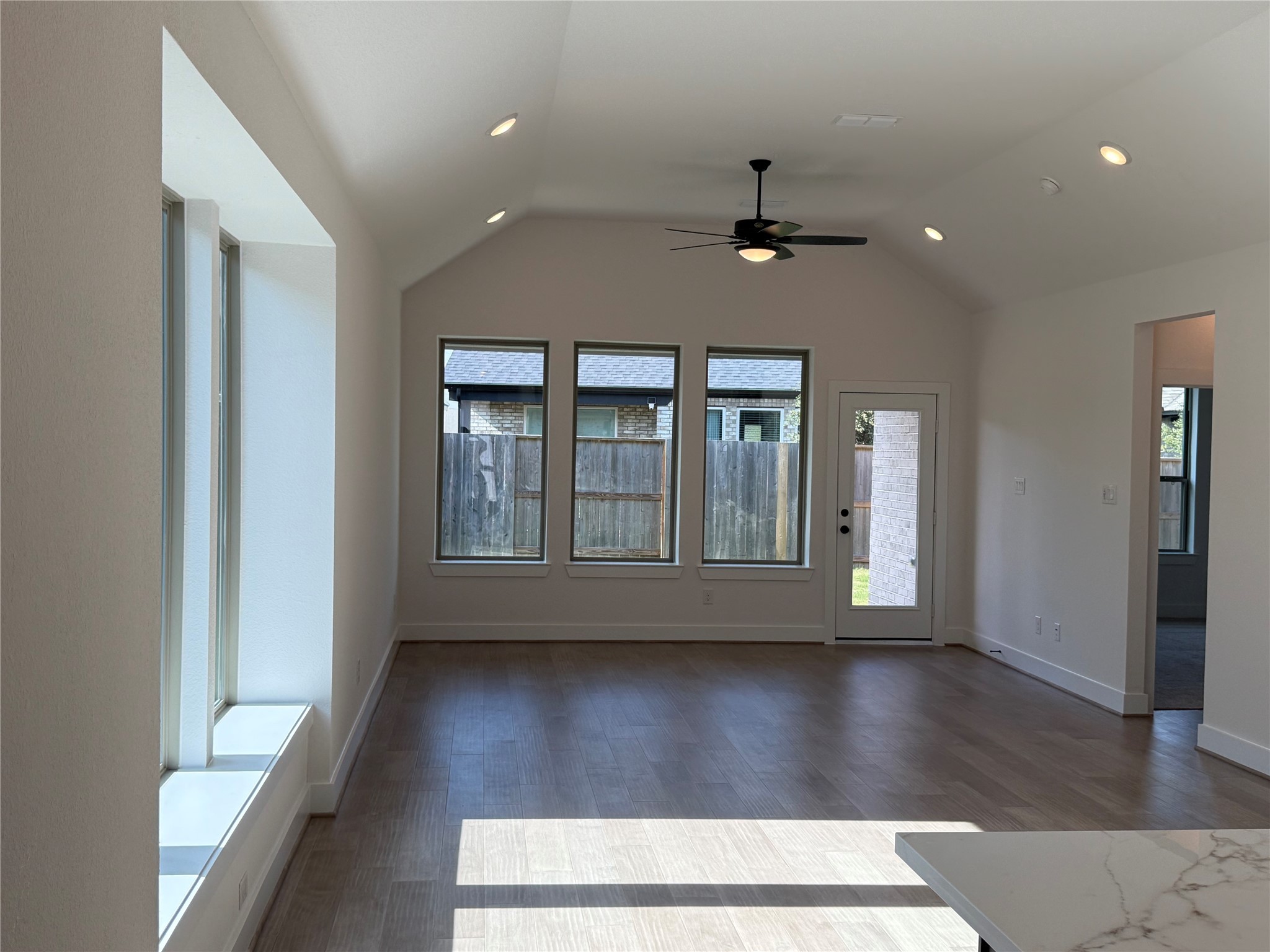 5111 Getty Lane Manvel, TX 77578 - Photo 3 of 38 a view of wooden floor and a chandelier fan in a room