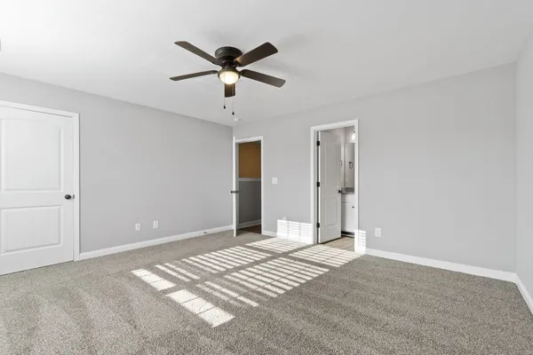 a view of a livingroom with a chandelier fan
