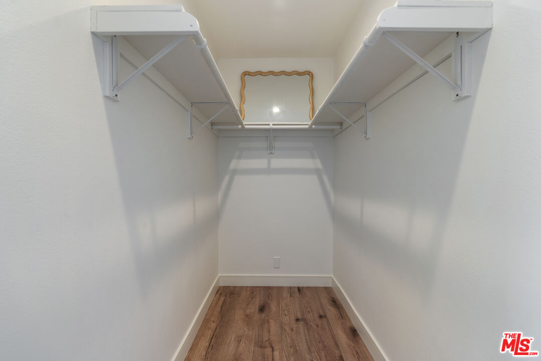4555 Falkirk Bay, Unit BAY Oxnard, CA 93035 - Photo 20 of 46 a view of a hallway with wooden floor