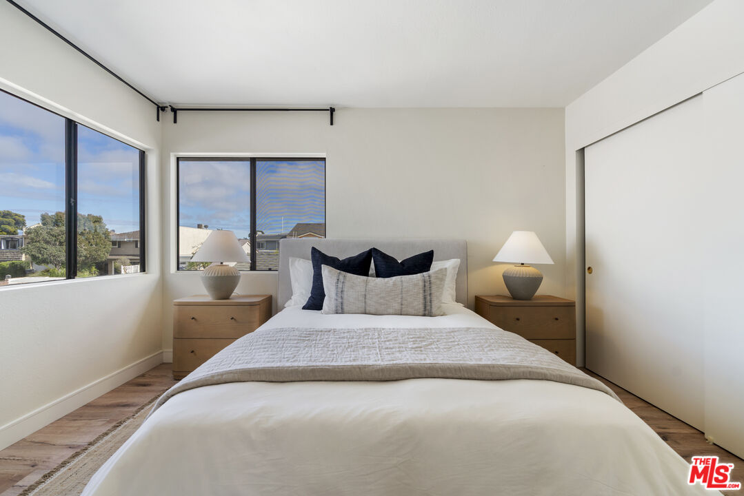 4555 Falkirk Bay, Unit BAY Oxnard, CA 93035 - Photo 25 of 46 a bed room with a bed and a large window