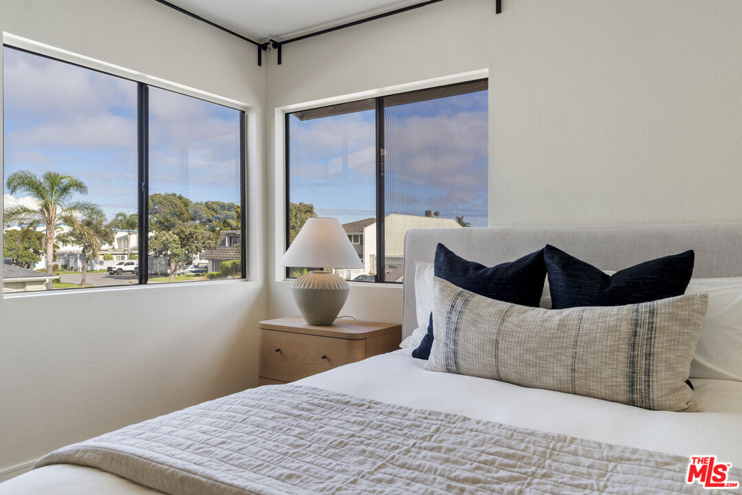 4555 Falkirk Bay, Unit BAY Oxnard, CA 93035 - Photo 26 of 46 a bedroom with a bed and window