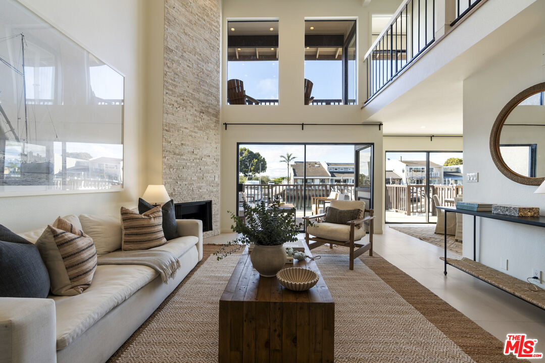 4555 Falkirk Bay, Unit BAY Oxnard, CA 93035 - Photo 3 of 46 a living room with furniture and a large window