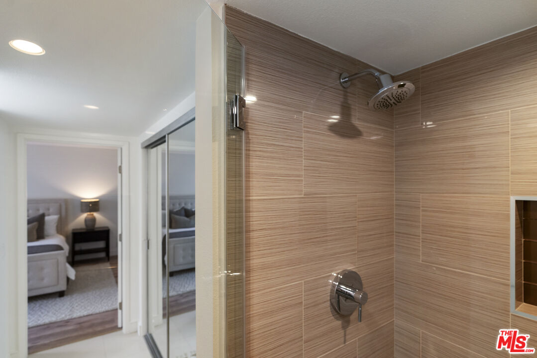 4555 Falkirk Bay, Unit BAY Oxnard, CA 93035 - Photo 32 of 46 a bathroom with a shower and a sink
