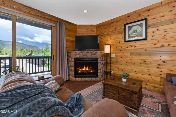 a bedroom with a bed and a fireplace