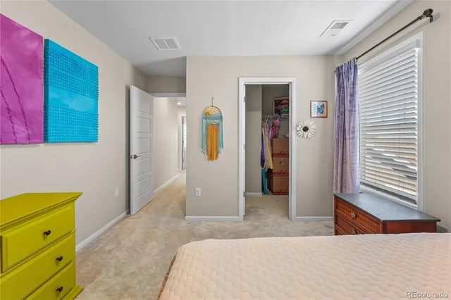 a bedroom with a bed and a cabinets