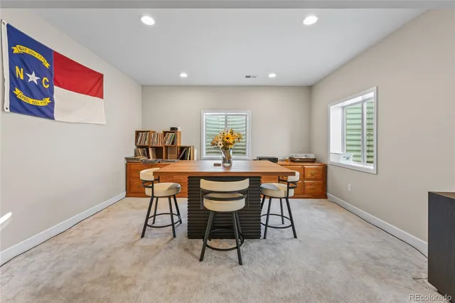 a dining room with furniture and window
