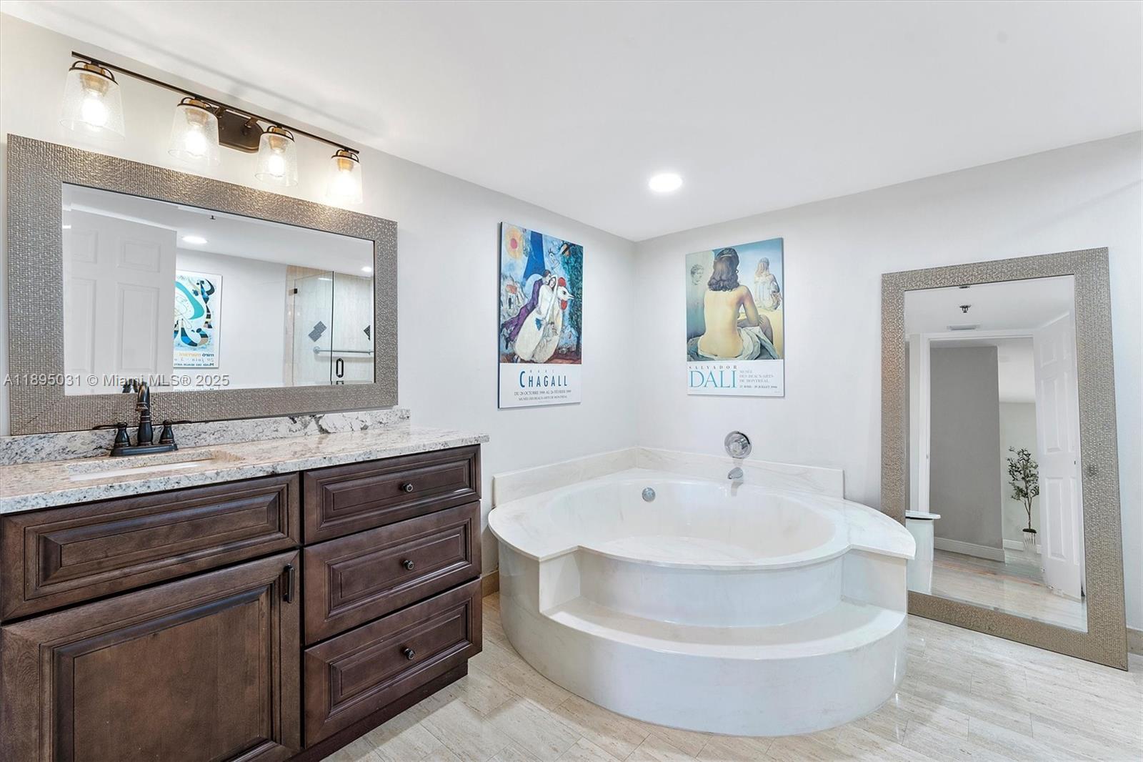 7225 Promenade Drive, Unit 102 Boca Raton, FL 33433 - Photo 13 of 18 a bathroom with a sink and a mirror