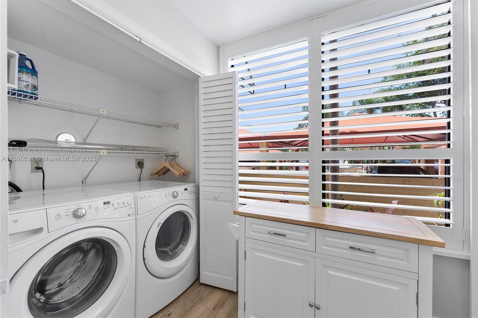 7225 Promenade Drive, Unit 102 Boca Raton, FL 33433 - Photo 7 of 18 a view of kitchen and utility room
