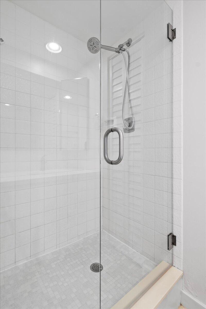 6038 Southeast Riverboat Drive, Unit 716 Stuart, FL 34997 - Photo 14 of 28 a bathroom with a shower