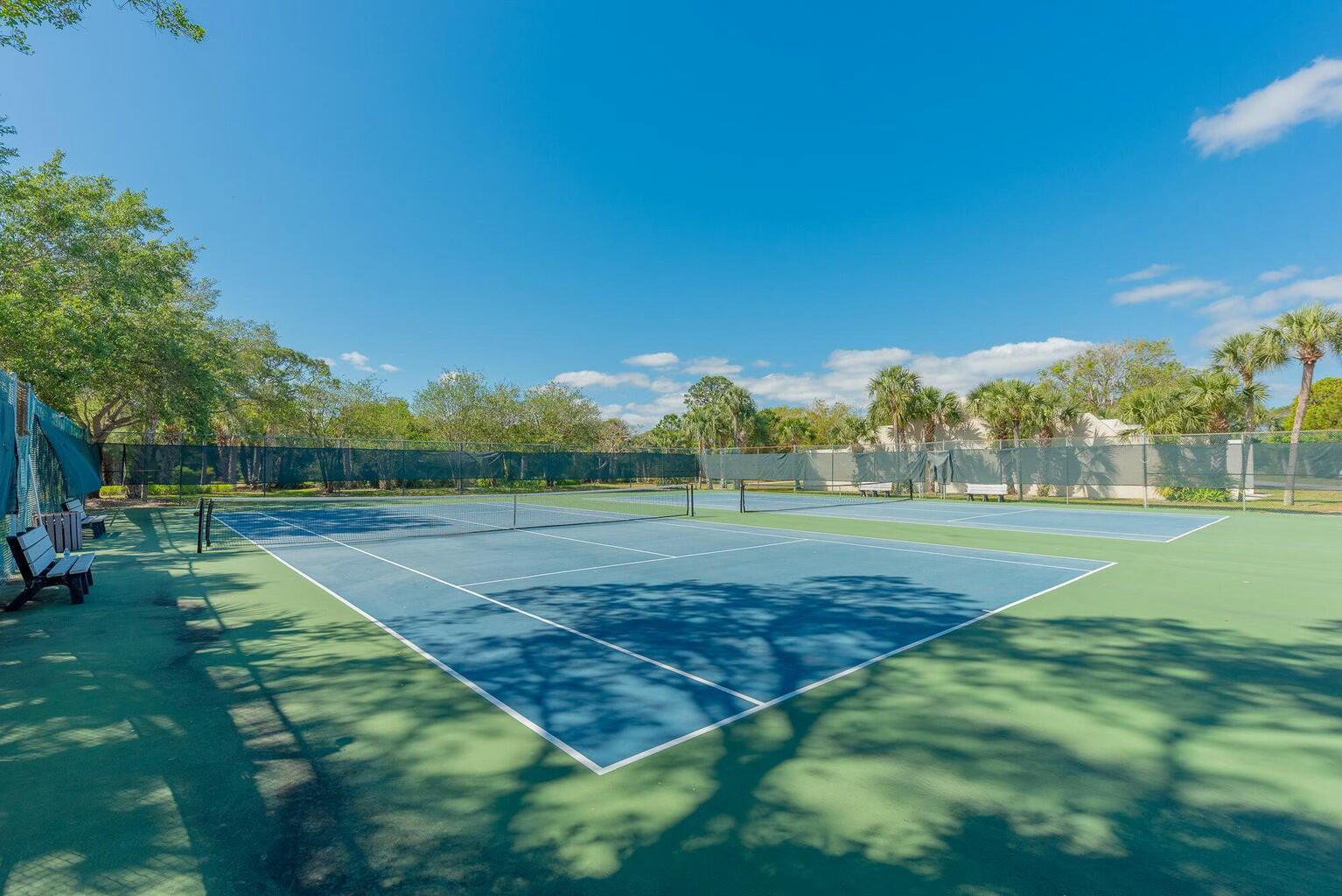 6038 Southeast Riverboat Drive, Unit 716 Stuart, FL 34997 - Photo 20 of 28 a view of grassy field with trees