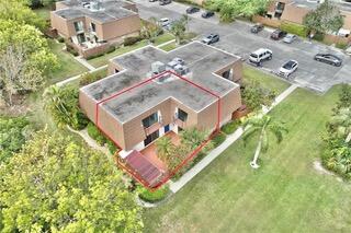 6038 Southeast Riverboat Drive, Unit 716 Stuart, FL 34997 - Photo 27 of 28 an aerial view of residential house with an outdoor space and seating