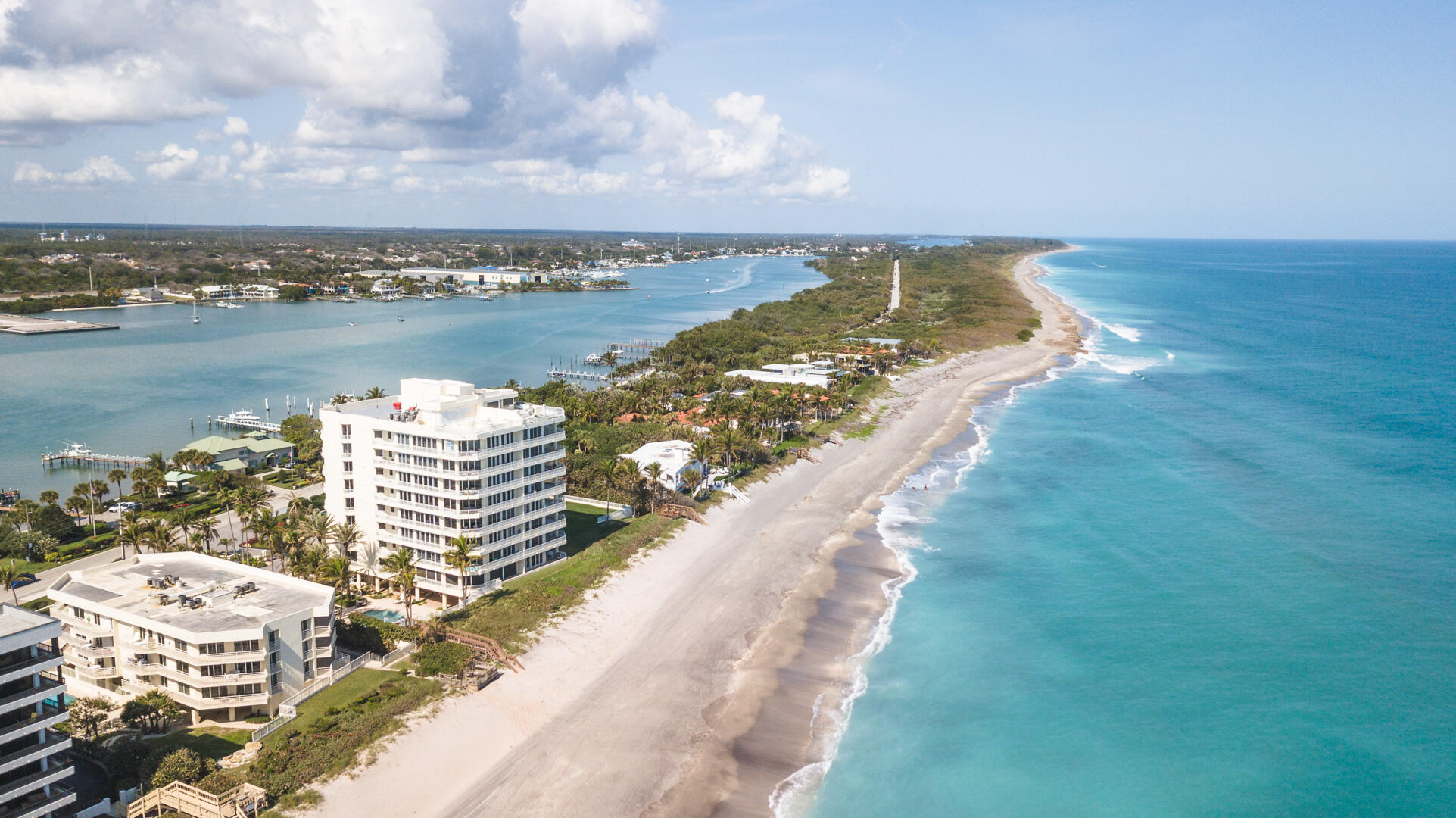 19950 South Beach Road, Unit 4 Tequesta, FL 33469 - Photo 1 of 56 a view of a city and an ocean view