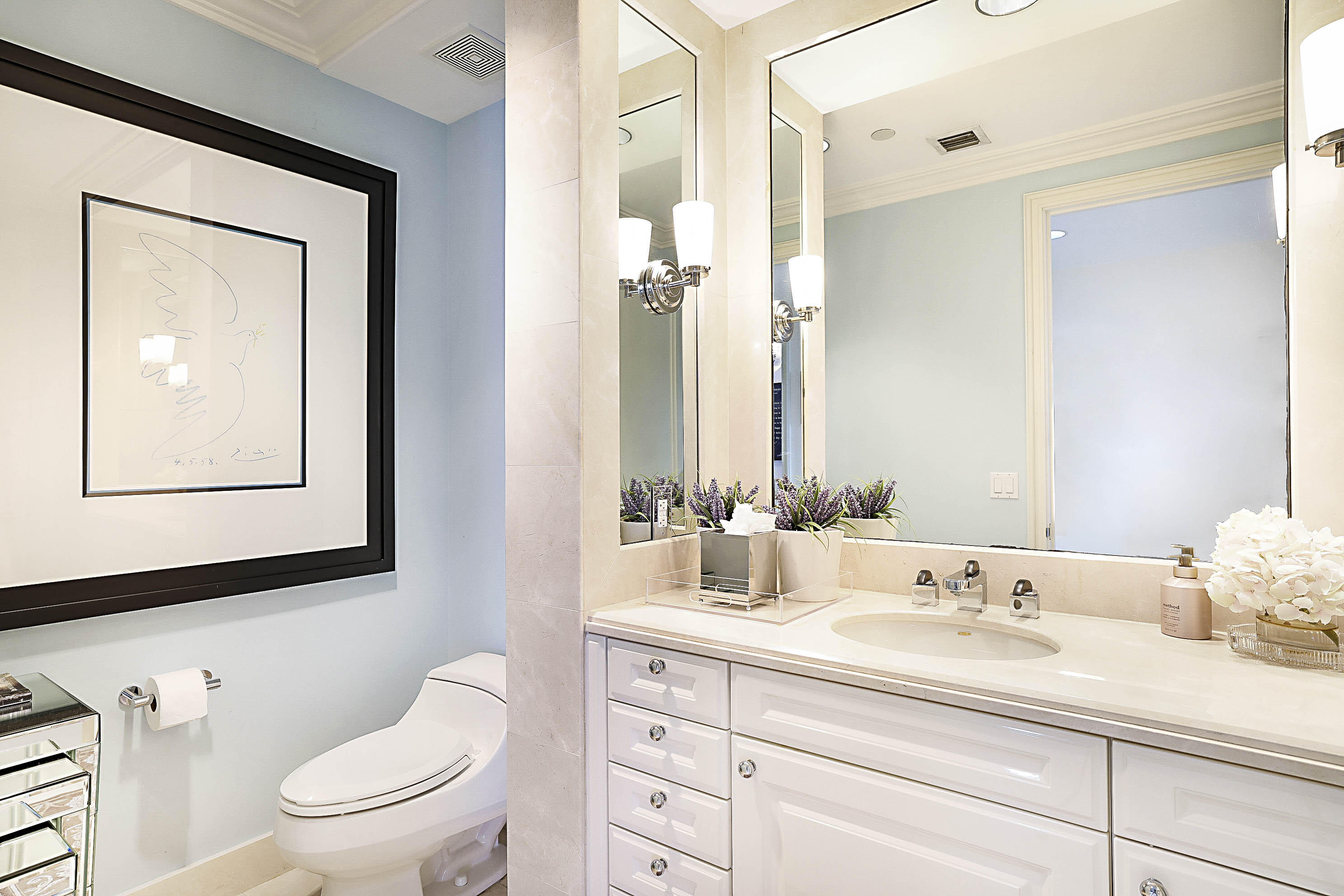 19950 South Beach Road, Unit 4 Tequesta, FL 33469 - Photo 15 of 56 a bathroom with a granite countertop toilet a sink and a mirror