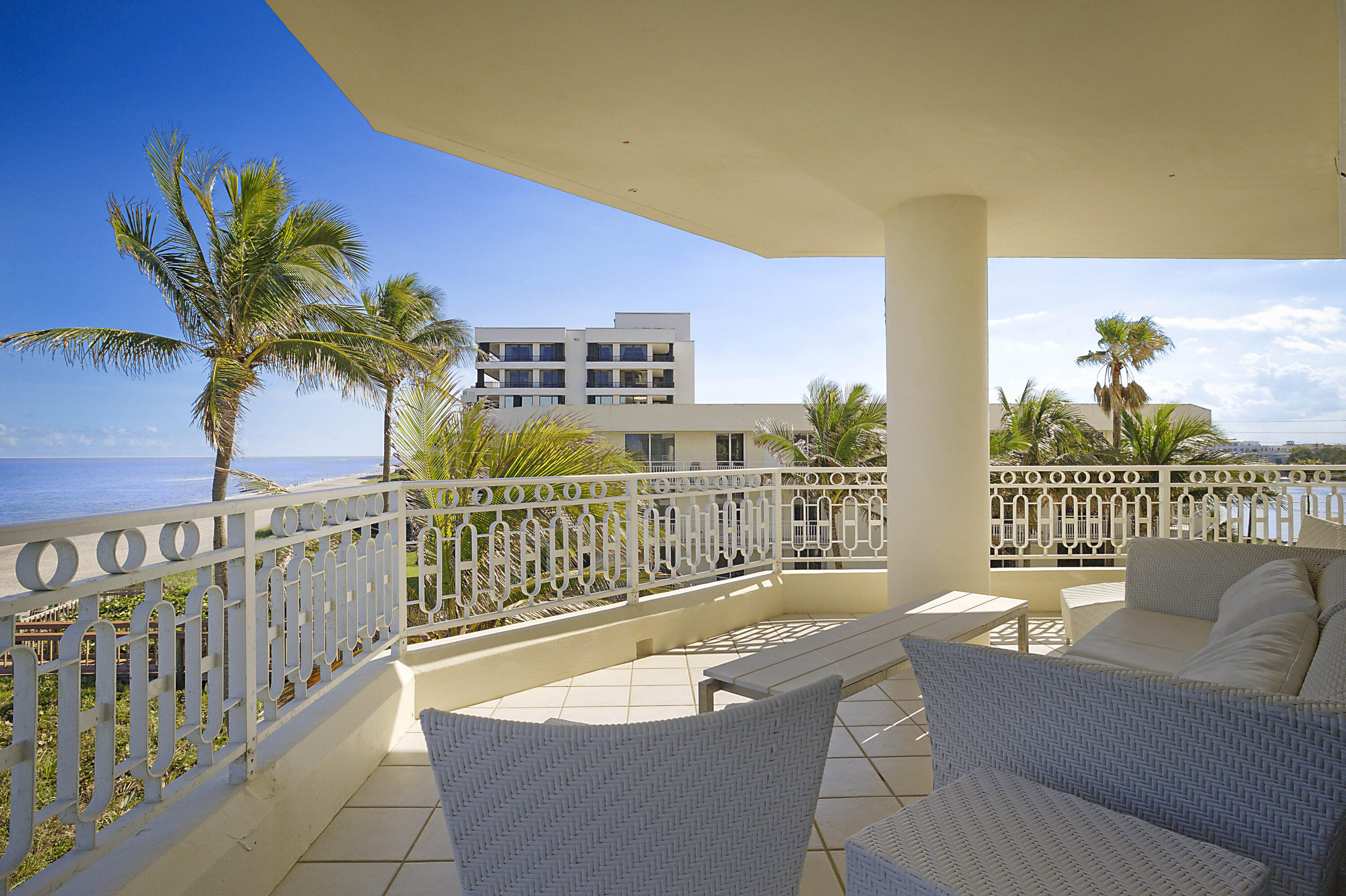 19950 South Beach Road, Unit 4 Tequesta, FL 33469 - Photo 32 of 56 a balcony with furniture and a potted plant