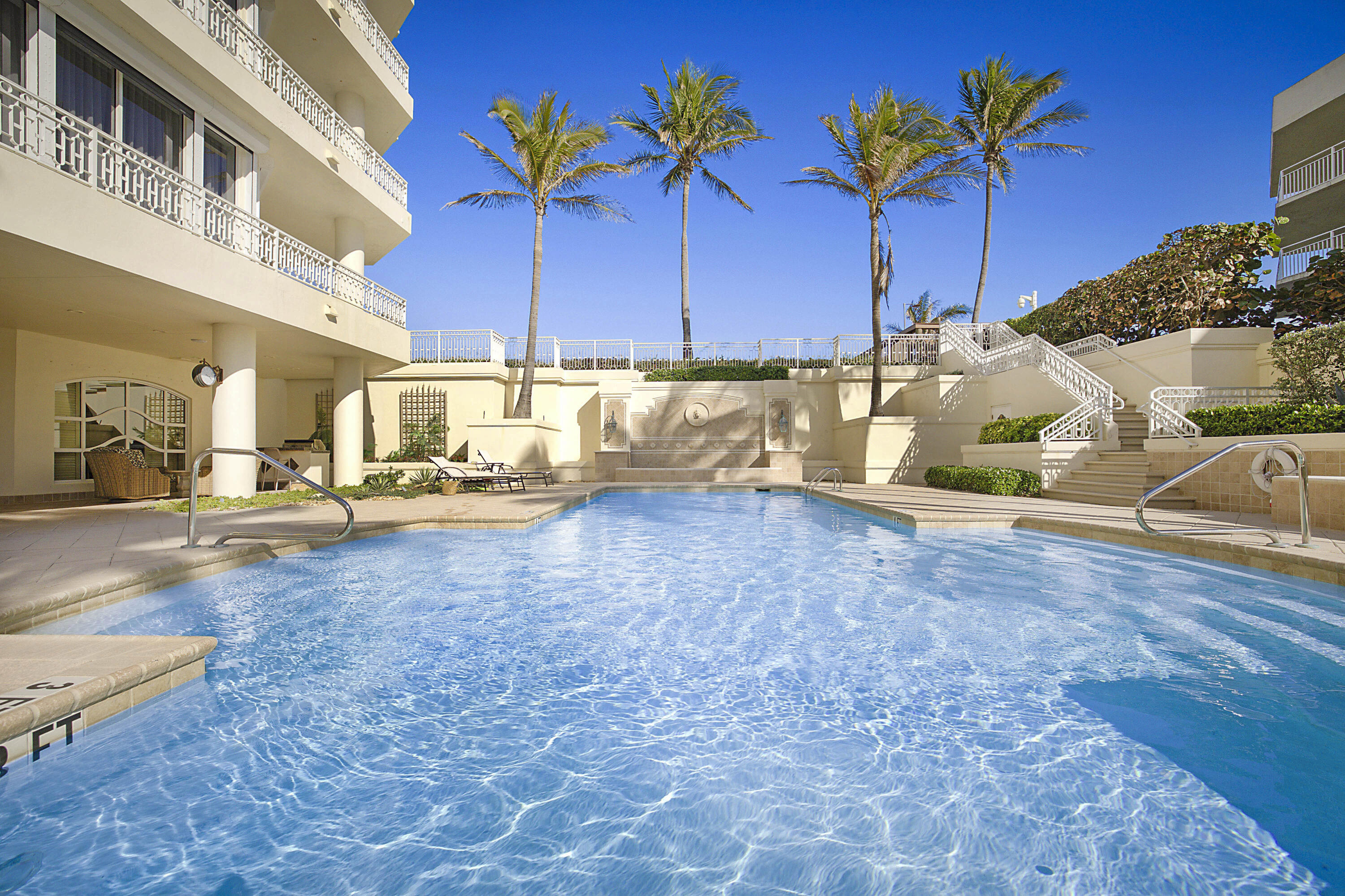 19950 South Beach Road, Unit 4 Tequesta, FL 33469 - Photo 43 of 56 a view of a pool table and chairs in patio