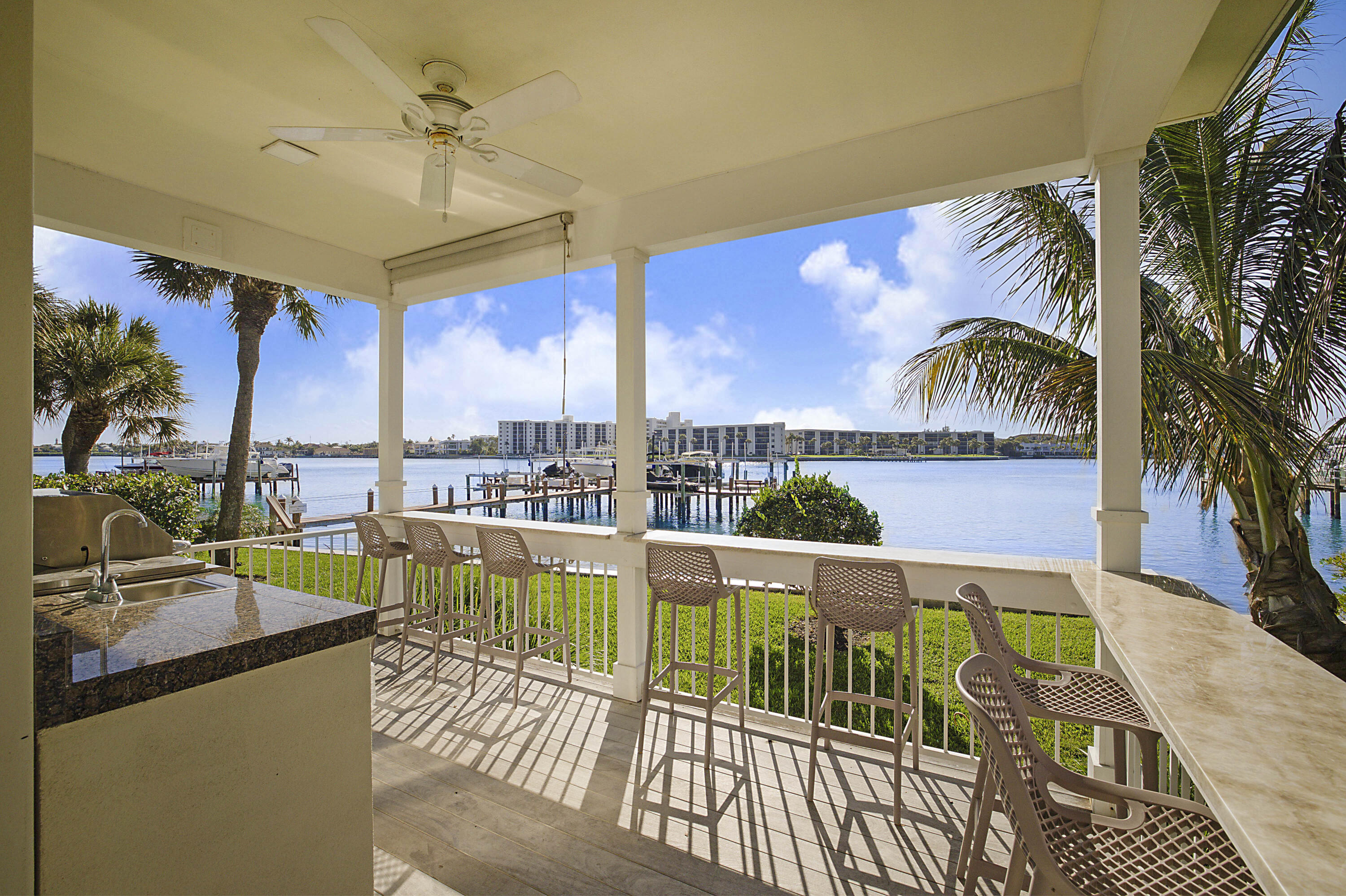 19950 South Beach Road, Unit 4 Tequesta, FL 33469 - Photo 47 of 56 a view of a balcony with furniture