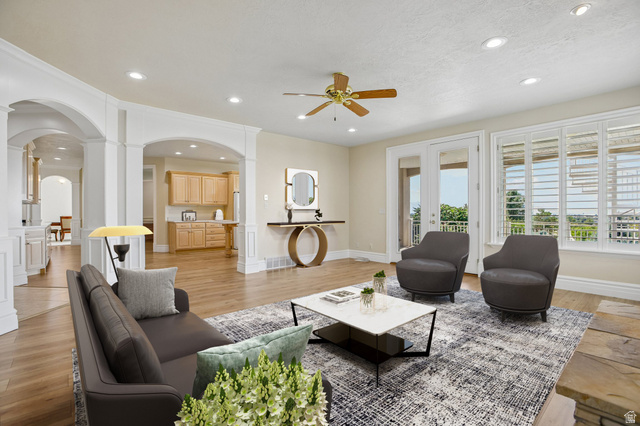 220 East Ridge Road Orem, UT 84057 - Photo 15 of 52 Recessed lighting, wood-finish flooring, and arched doorways define this living space