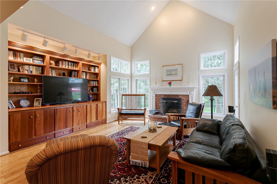 255 Totem Trail Irondequoit, NY 14617 - Photo 14 of 48 Custom built cherry cabinetry, a wood burning fire