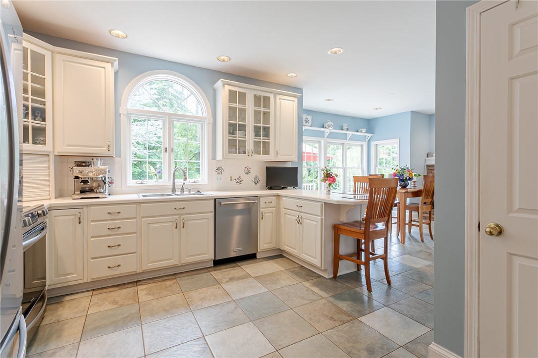 255 Totem Trail Irondequoit, NY 14617 - Photo 16 of 48 Beautifully appointed Kitchen with white wood cabi
