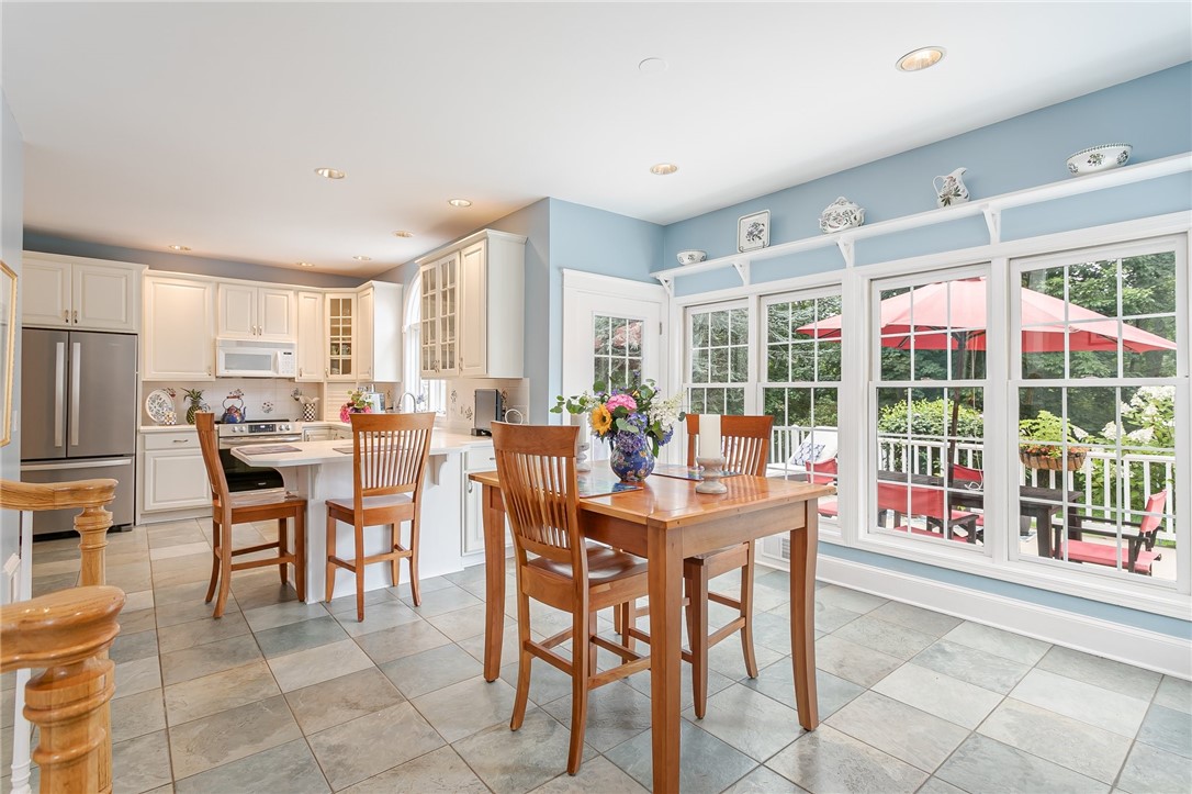 255 Totem Trail Irondequoit, NY 14617 - Photo 21 of 48 Access to the deck & a wall of windows overlooking