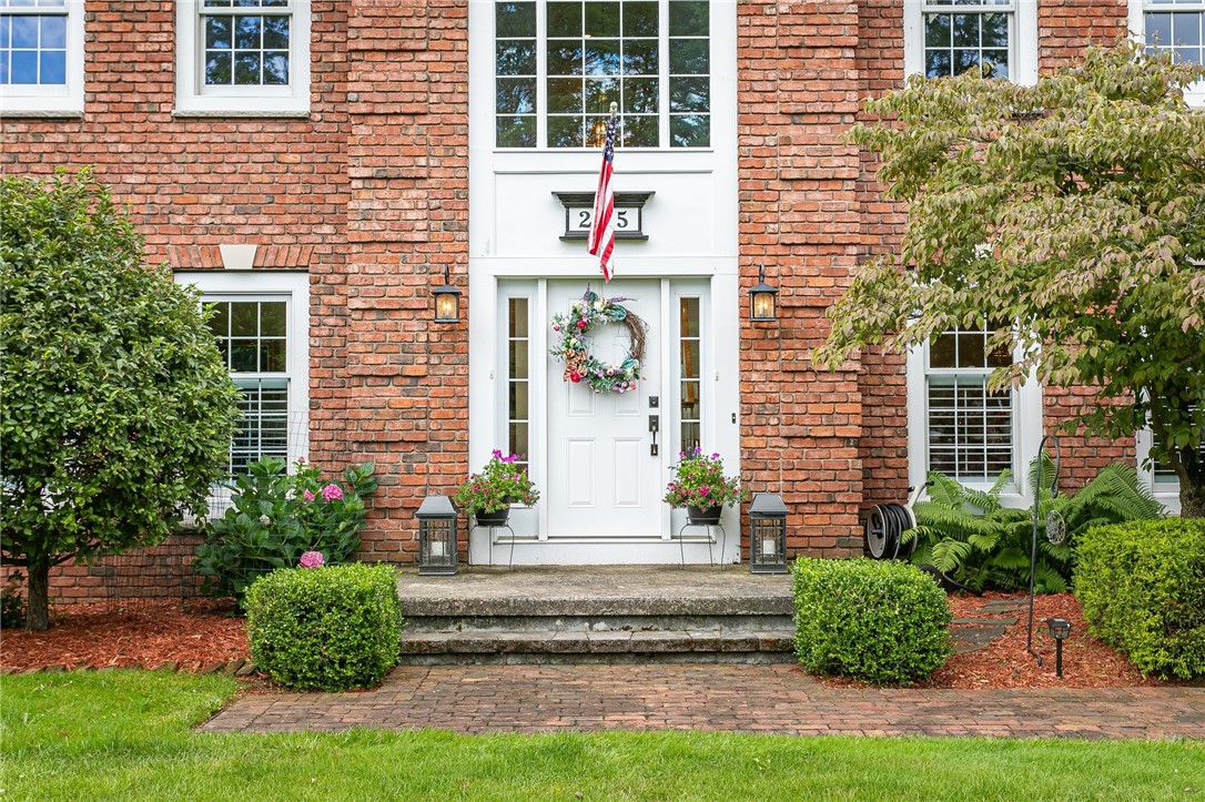 255 Totem Trail Irondequoit, NY 14617 - Photo 5 of 48 Custom brick walkway leads to the front of this im