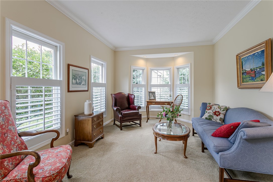 255 Totem Trail Irondequoit, NY 14617 - Photo 8 of 48 Living Room with bay window & plantation shutters