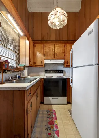 a view of an empty room with windows