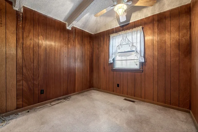 a balcony with wooden floor and furniture