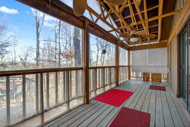 a view of a balcony with wooden floor
