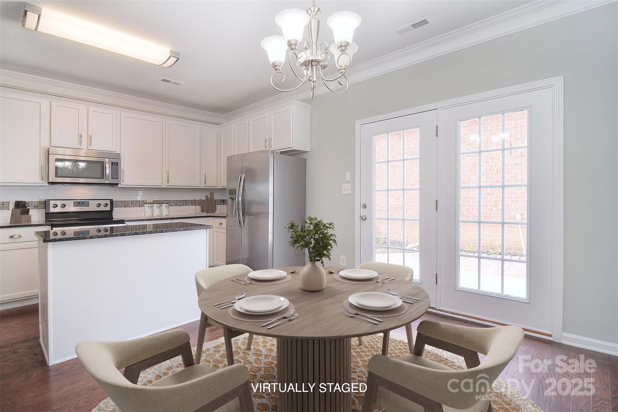7002 Creft Circle Indian Trail, NC 28079 - Photo 15 of 47 a kitchen with stainless steel appliances granite countertop a stove a refrigerator a sink dishwasher a dining table and chairs with wooden floor