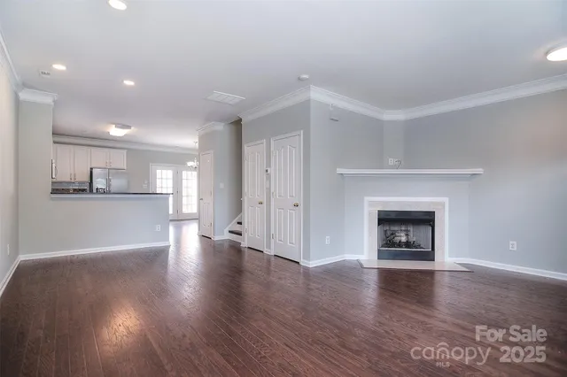 a view of a kitchen with a sink and a fireplace