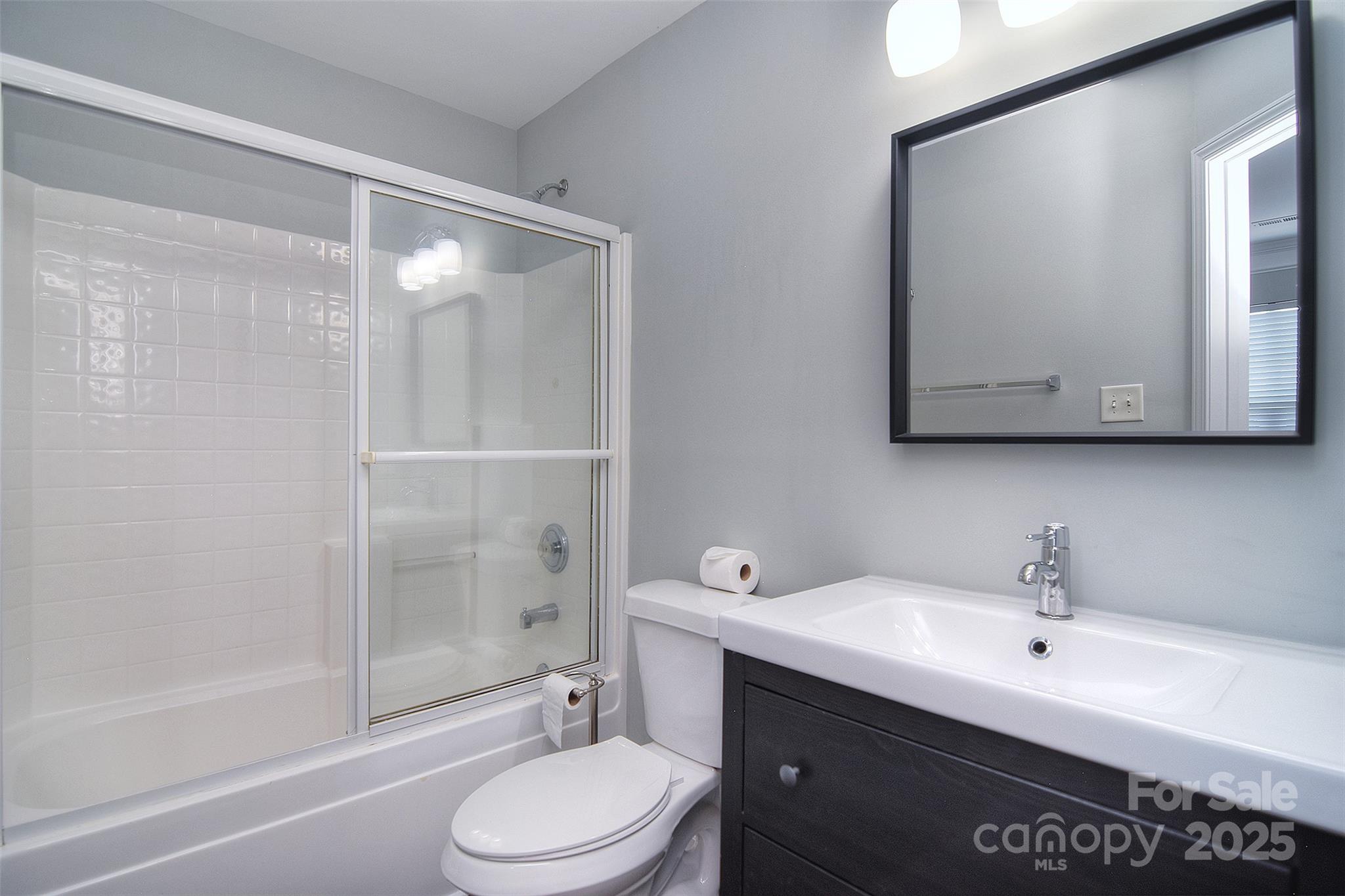 7002 Creft Circle Indian Trail, NC 28079 - Photo 29 of 47 a bathroom with a sink a toilet and shower