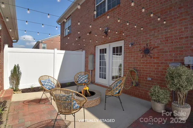 a front view of a house with outdoor seating