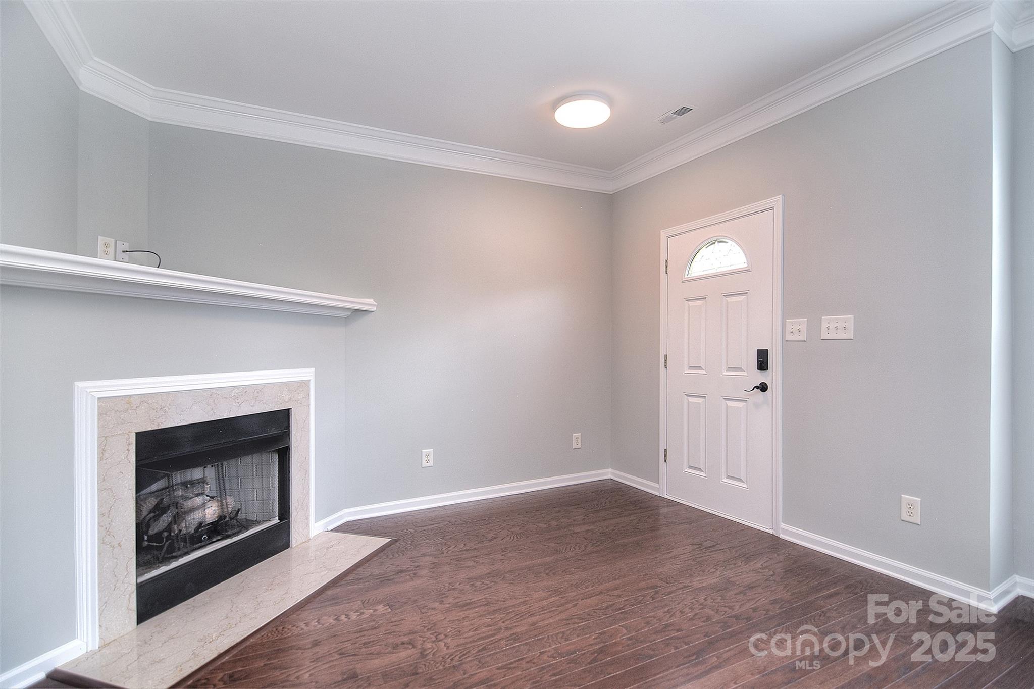 7002 Creft Circle Indian Trail, NC 28079 - Photo 5 of 47 a view of an empty room with window and fire place