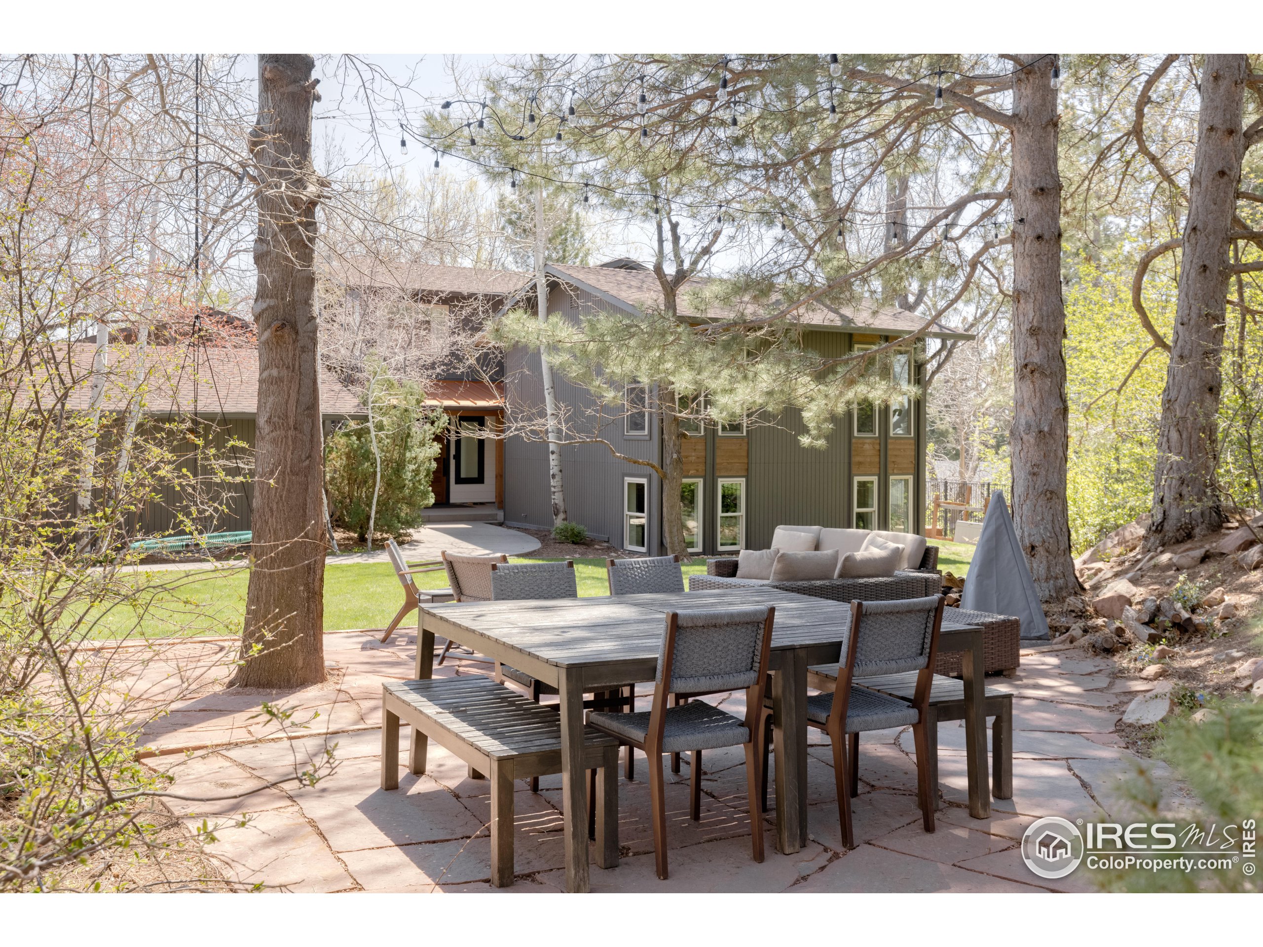 3716 Wonderland Hill Avenue Boulder, CO 80304 - Photo 1 of 31 a view of a patio with table and chairs and potted plants