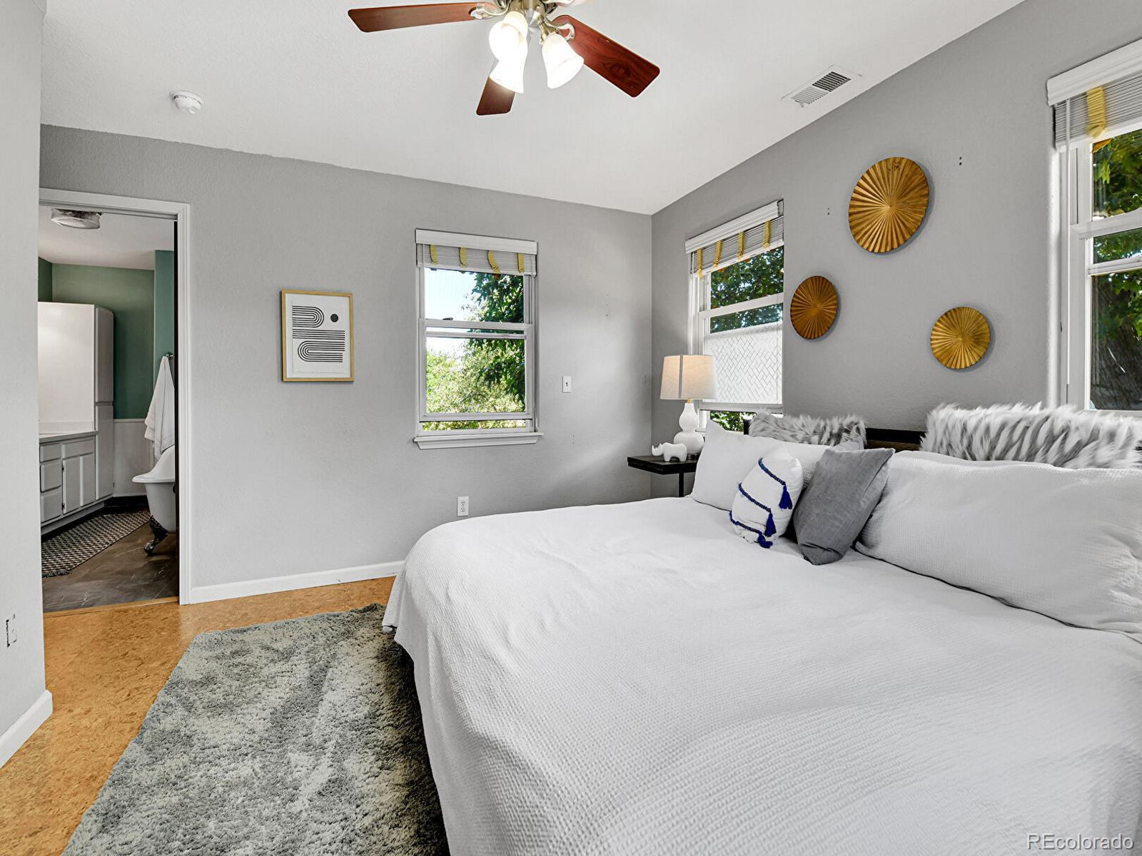 3282 Depew Street Wheat Ridge, CO 80212 - Photo 27 of 50 a bedroom with a large bed and a window