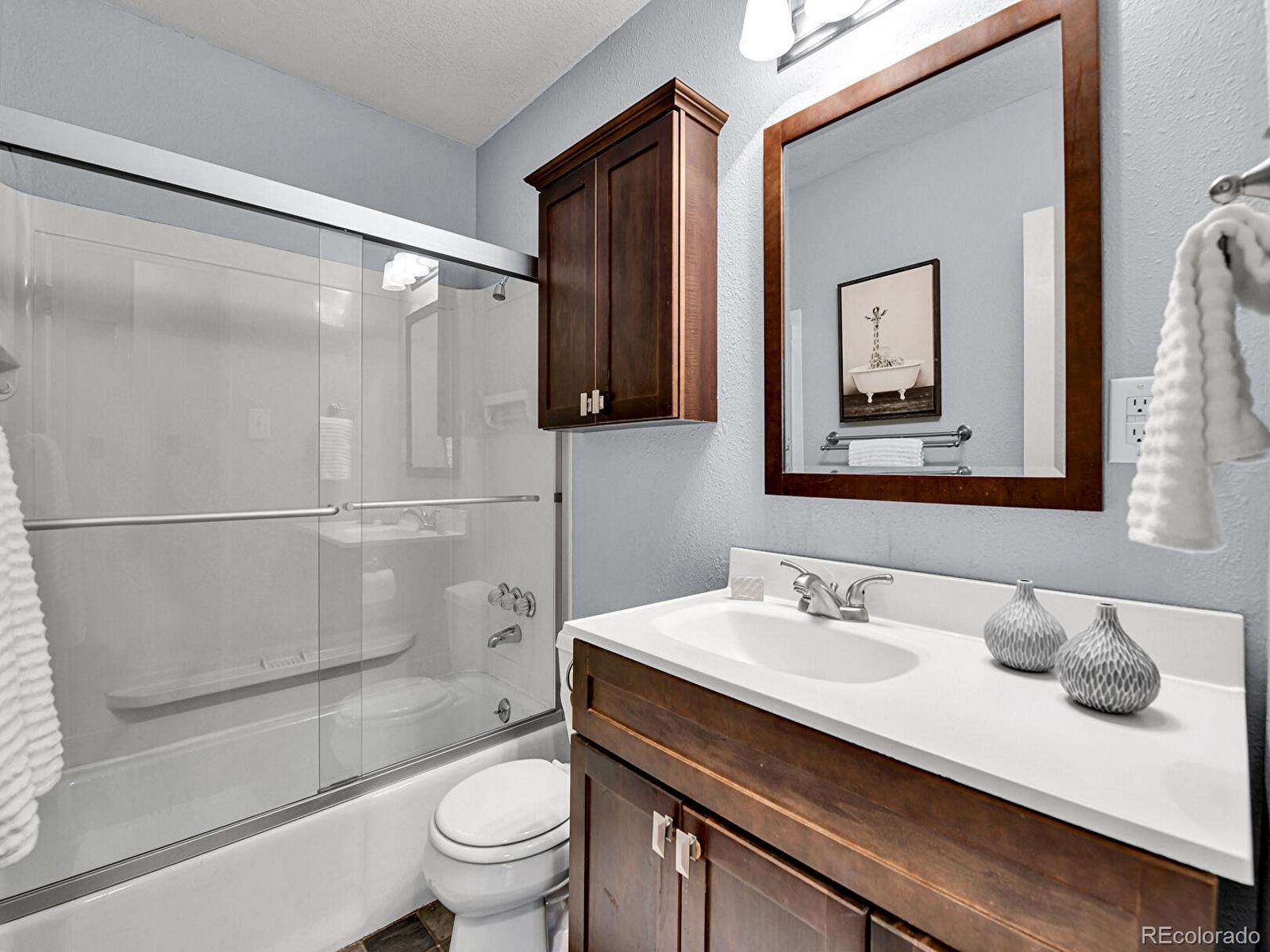3282 Depew Street Wheat Ridge, CO 80212 - Photo 38 of 50 a bathroom with a sink and a mirror