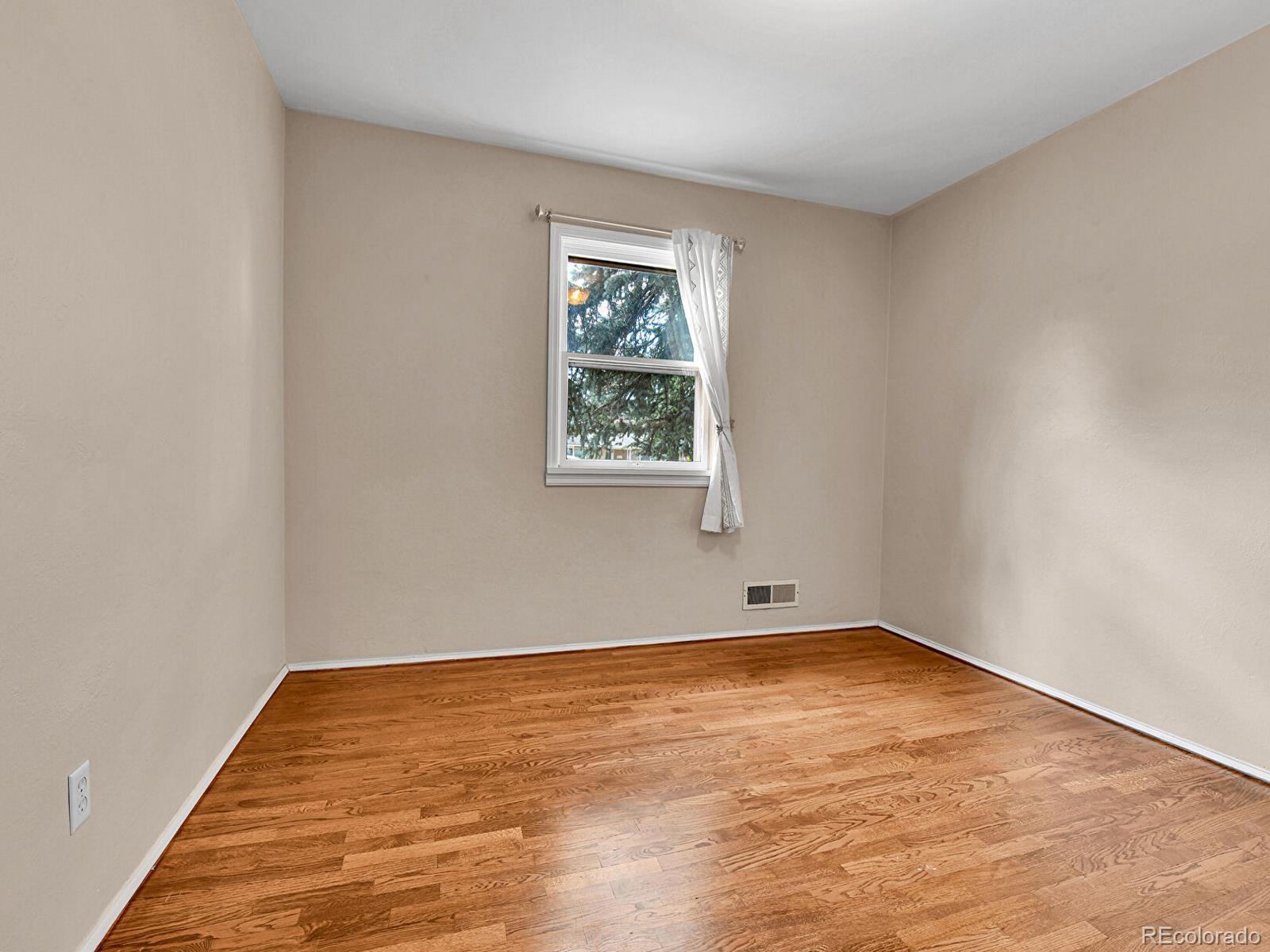 3282 Depew Street Wheat Ridge, CO 80212 - Photo 39 of 50 an empty room with a window