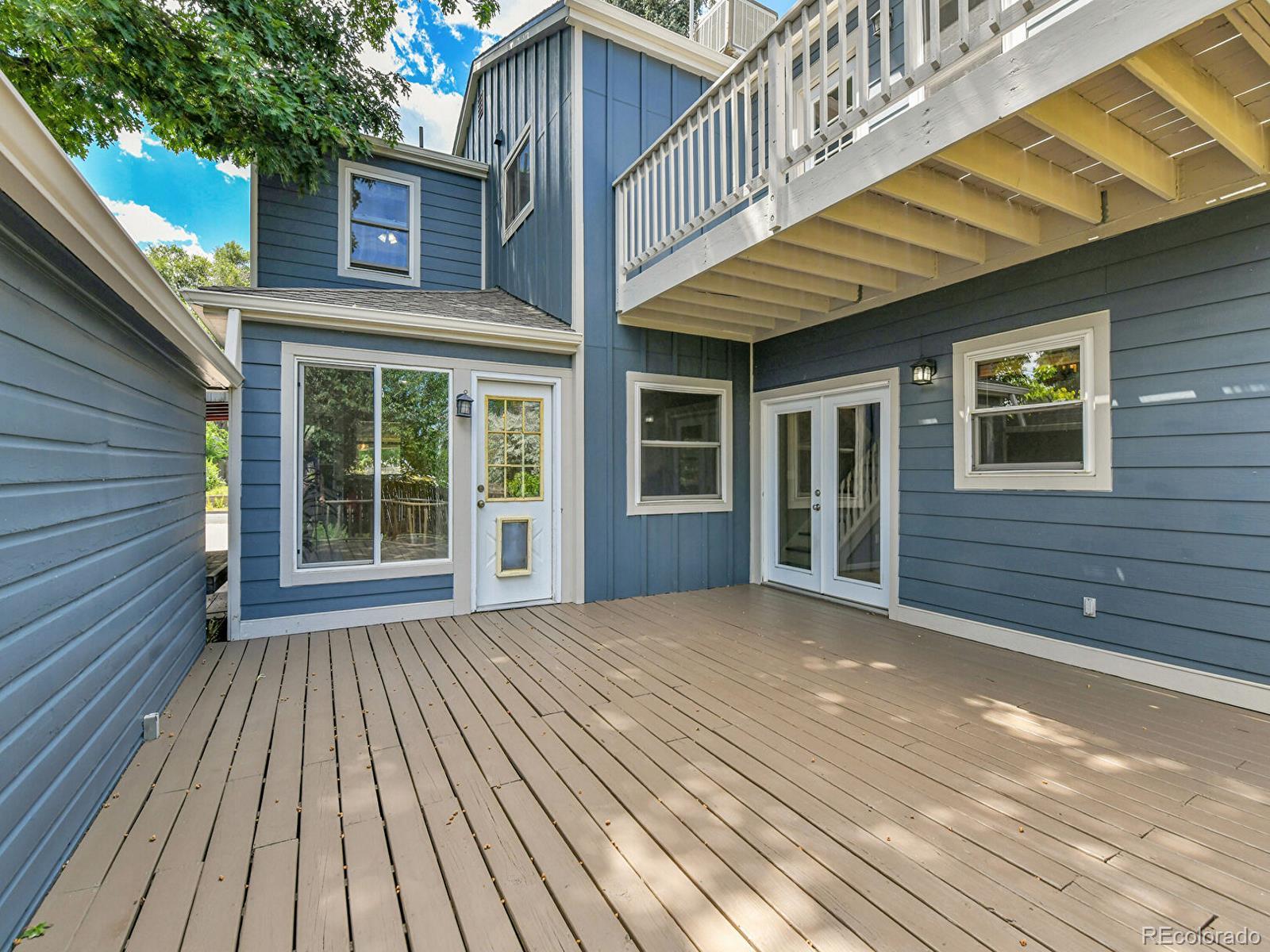 3282 Depew Street Wheat Ridge, CO 80212 - Photo 41 of 50 a view of backyard with a deck and wooden floor